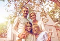 Happy family in front of house outdoors Royalty Free Stock Photo