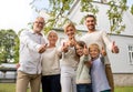 Happy family in front of house outdoors Royalty Free Stock Photo