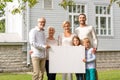 Happy family in front of house outdoors Royalty Free Stock Photo