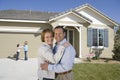 Happy Family In Front Of New House Royalty Free Stock Photo
