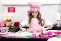 Happy family funny child prepares dough, bake cakes in the kitchen. Royalty Free Stock Photo