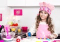 Happy family funny child prepares dough, bake cakes in the kitchen. Royalty Free Stock Photo