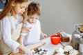 Happy family funny kids are preparing the dough, bake cookies in the kitchen Royalty Free Stock Photo