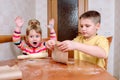 Happy family funny kids are preparing the dough, bake cookies in the kitchen Royalty Free Stock Photo