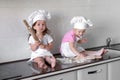 Happy family funny kids are preparing the dough, bake cookies in the kitchen Royalty Free Stock Photo