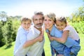 Happy family in the garden having fun Royalty Free Stock Photo