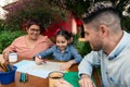 Happy family generations drawing together in table outside Royalty Free Stock Photo
