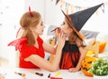 Happy family getting ready for halloween make make-up Royalty Free Stock Photo