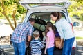 Happy family getting ready for road trip Royalty Free Stock Photo