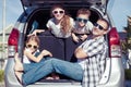 Happy family getting ready for road trip on a sunny day Royalty Free Stock Photo