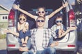 Happy family getting ready for road trip on a sunny day Royalty Free Stock Photo