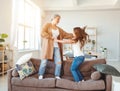 Happy family grandma and granddaughter dancing and laugh at home Royalty Free Stock Photo