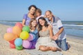 Happy family. Grandmother, grandfather, Mother, youngest daughter and an seventeen-year-old daughter with Down syndrome. Royalty Free Stock Photo