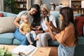 Happy family. Grandmother, mother, aunt and little baby having fun at home. Relatives visiting new born child Royalty Free Stock Photo