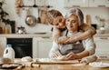 Happy family grandmother old mother mother-in-law and daughter-in-law daughter cook in kitchen, knead dough, bake cookies