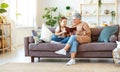 Happy family grandmother reading to granddaughter book at home Royalty Free Stock Photo
