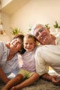 Happy family. Grandparents with granddaughter at home. Royalty Free Stock Photo