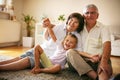 Happy family. Grandparents with granddaughter at home. Royalty Free Stock Photo