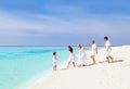 Happy family with grandparents playing on beach Royalty Free Stock Photo