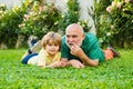 Happy family Grandson hugs his grandpa on holiday. Family summer and active holidays. Grandfather with son in park Royalty Free Stock Photo