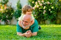 Happy family Grandson hugs his grandpa on holiday. Grandfather and grandson Playing - Family Time Together. Happy family Royalty Free Stock Photo