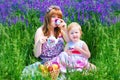 Happy Family in Green Grass take a Teaparty. Royalty Free Stock Photo