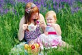 Happy Family in Green Grass take a Teaparty. Royalty Free Stock Photo