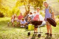 Happy family grilling meat Royalty Free Stock Photo