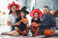 Happy family with Halloween candy buckets and pumpkin head jack lantern Royalty Free Stock Photo