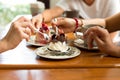 Happy family hands on banoffee cake