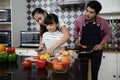 Happy Family have Dad, Mom and their little daughter Cooking Tog Royalty Free Stock Photo