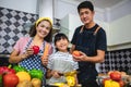 Happy Family have Dad, Mom and their little daughter Cooking Together in the Kitchen Royalty Free Stock Photo