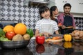 Happy Family have Dad, Mom and their little daughter Cooking Together in the Kitchen Royalty Free Stock Photo