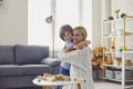 Happy family have fun playing board games in the room. Mother and daughter hugging cute after playing at home Royalty Free Stock Photo