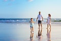 Happy family have fun on sunset beach Royalty Free Stock Photo