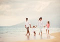 Happy Family have Fun Walking on Beach at Sunset Royalty Free Stock Photo