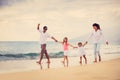 Happy Family have Fun Walking on Beach at Sunset Royalty Free Stock Photo