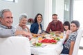 Happy family having breakfast Royalty Free Stock Photo