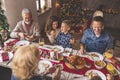 Happy family having Christmas dinner Royalty Free Stock Photo