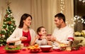 Happy family having christmas dinner at home