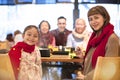 Happy family having dinner and celebrating chinese new year Royalty Free Stock Photo