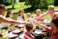 Happy family having dinner or summer garden party Royalty Free Stock Photo