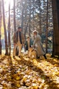 happy family is having fun with akita inu outdoors. Mother, father and son with dog in park Royalty Free Stock Photo