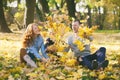 Happy family having fun in autumn urban park Royalty Free Stock Photo