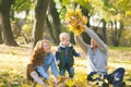 Happy family having fun in autumn urban park Royalty Free Stock Photo