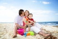 Happy family having fun on the beach. Royalty Free Stock Photo