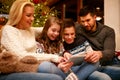 Happy family having fun on digital tablet for Christmas Royalty Free Stock Photo