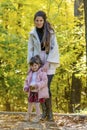 Happy Mother Having Fun with her Child in the Autumn Forest Royalty Free Stock Photo