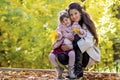 Happy Mother Having Fun with her Child in the Autumn Forest Royalty Free Stock Photo