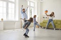 Happy mother, father and children playing ball games at home and having fun together Royalty Free Stock Photo